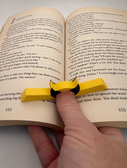 Masked Hero Page Holder No. 6 – yellow and black thumb book holder – photo 1