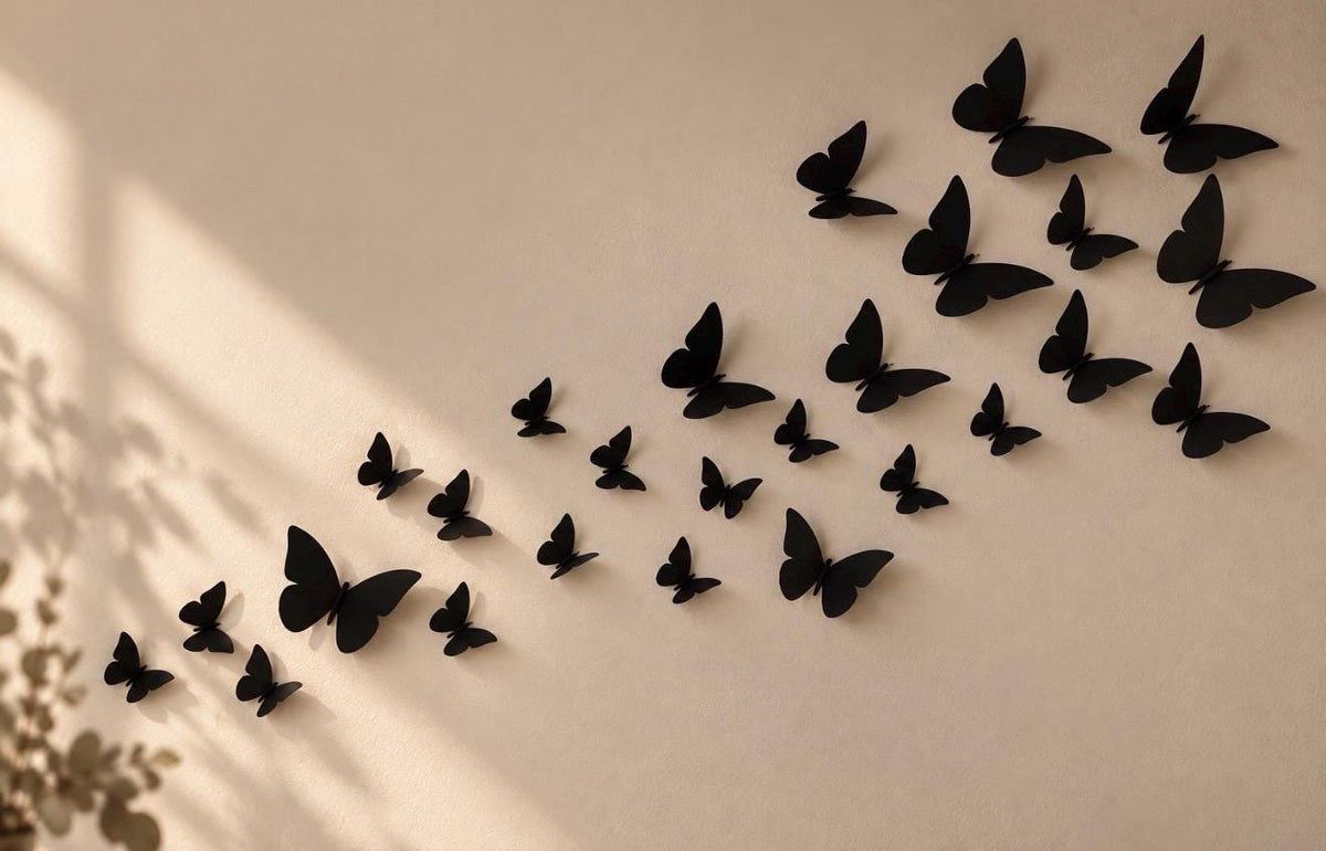 Butterfly wall decorations arranged in a sweeping line on a wall