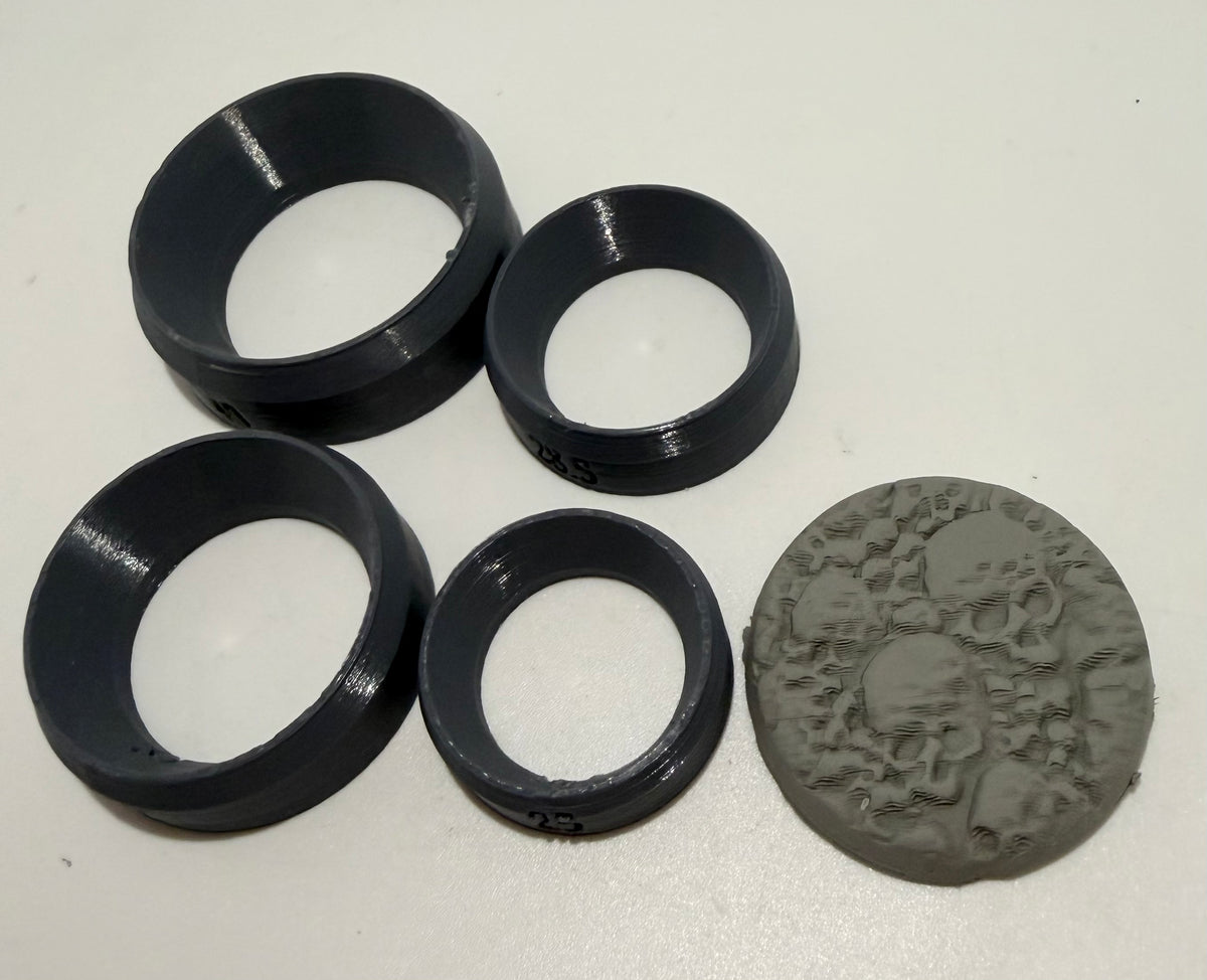 7-piece round miniature base cutter set with skull textured base