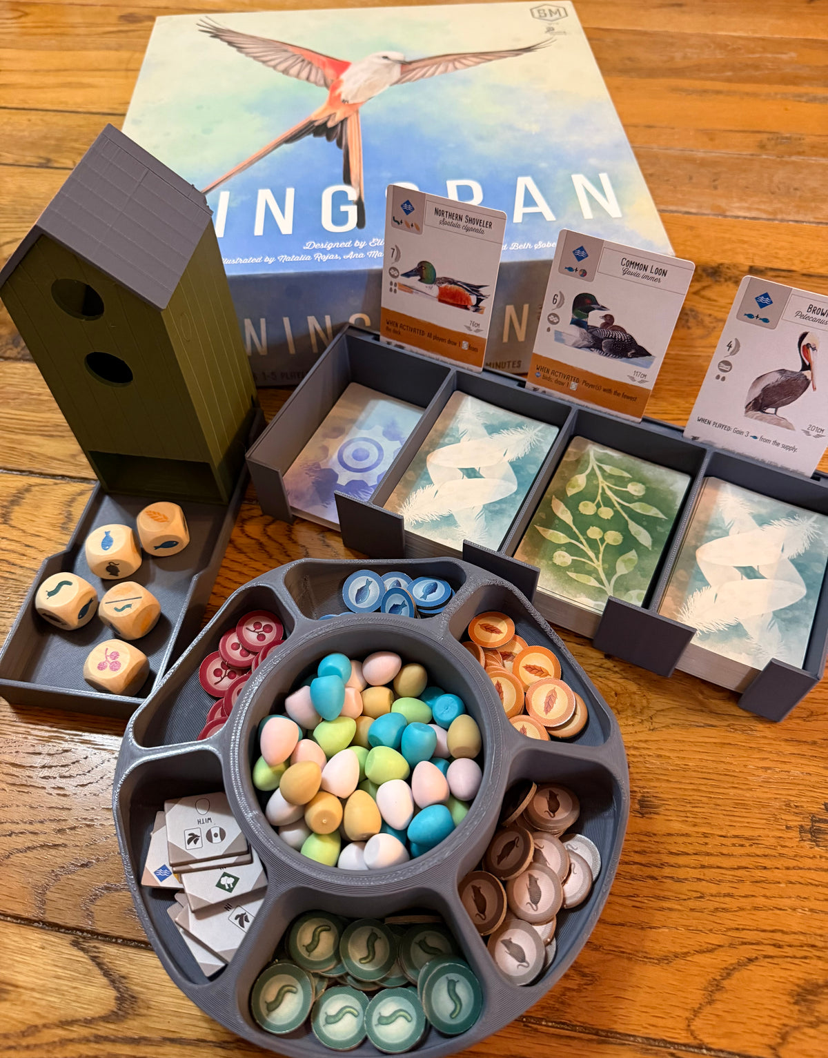 Central communal card bank compatible with Wingspan, holding the shared card decks with face-up bird cards displayed, 3D printed in PLA+
