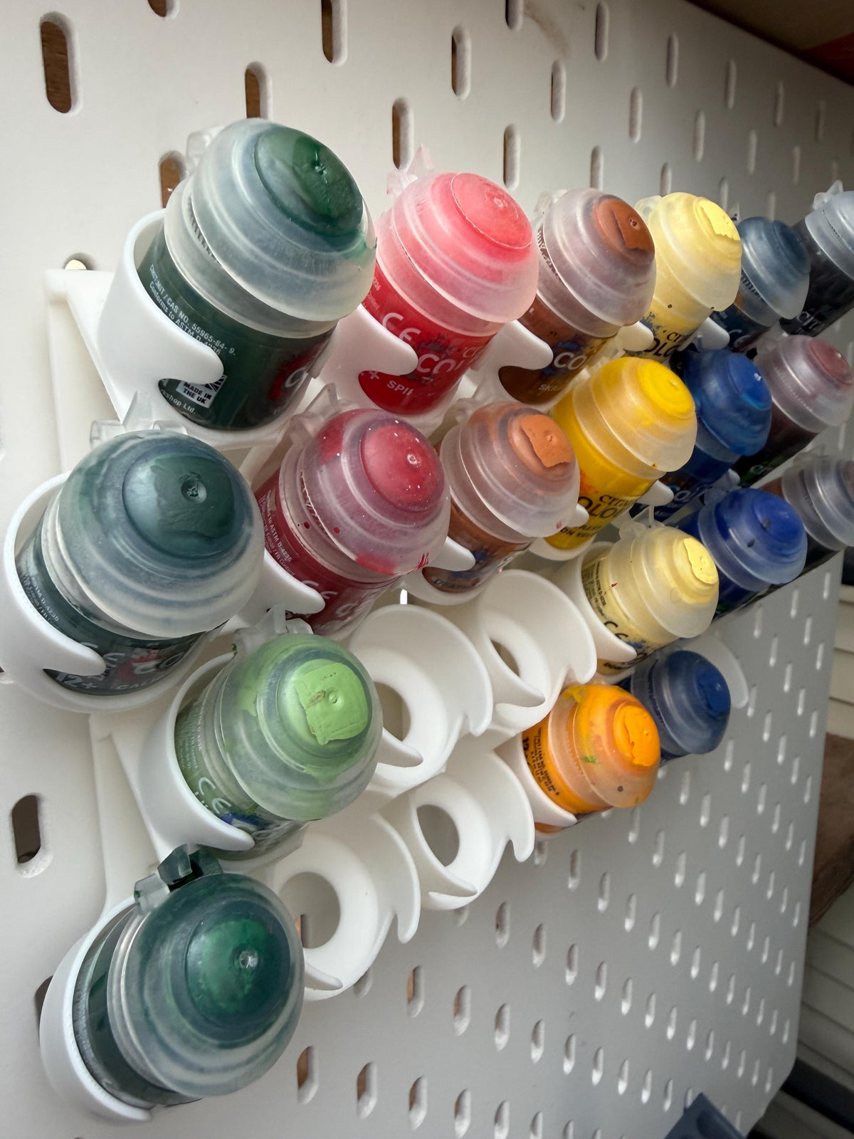 White staggered Citadel paint pot holders for IKEA SKÅDIS - angled empty view