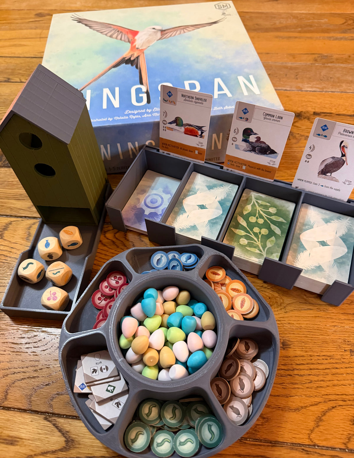 Complete three-piece organiser bundle compatible with Wingspan: central card bank, rotating egg and token organiser and birdhouse-style dice tower with tray, 3D printed in PLA+