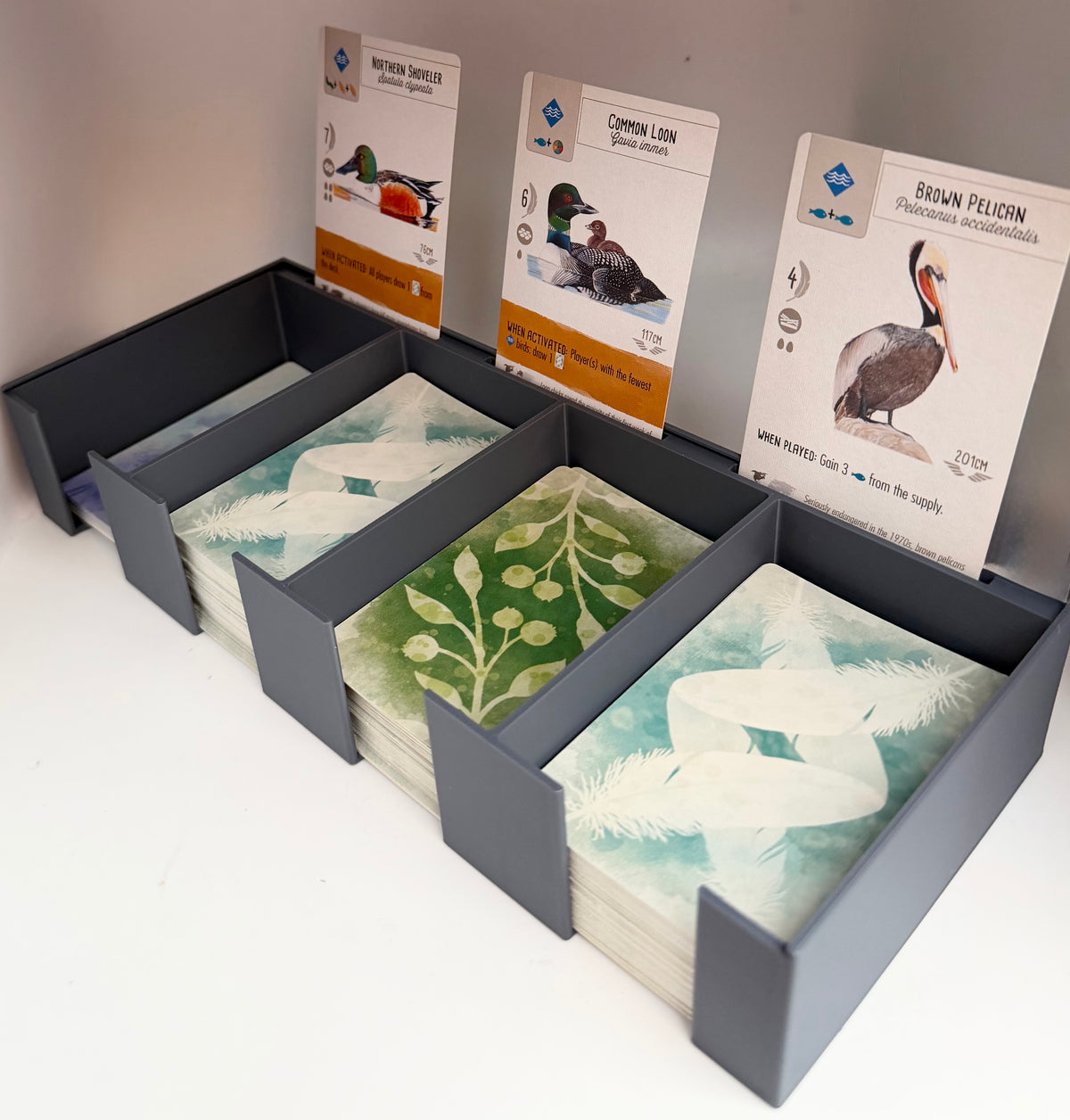 Complete three-piece organiser bundle compatible with Wingspan: central card bank, rotating egg and token organiser and birdhouse-style dice tower with tray, 3D printed in PLA+