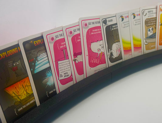 Curved card holders filled with playing cards
