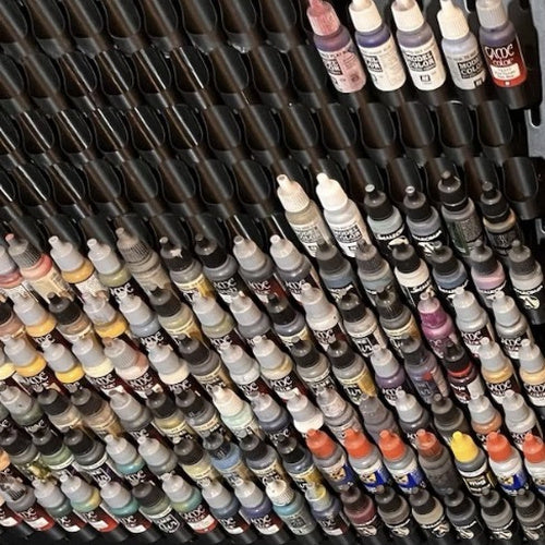 Customer SKÅDIS wall filled with dropper bottle paint holders