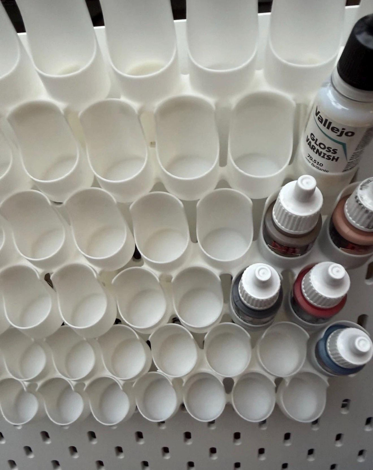 White dropper bottle paint holders for IKEA SKÅDIS with Vallejo dropper bottles