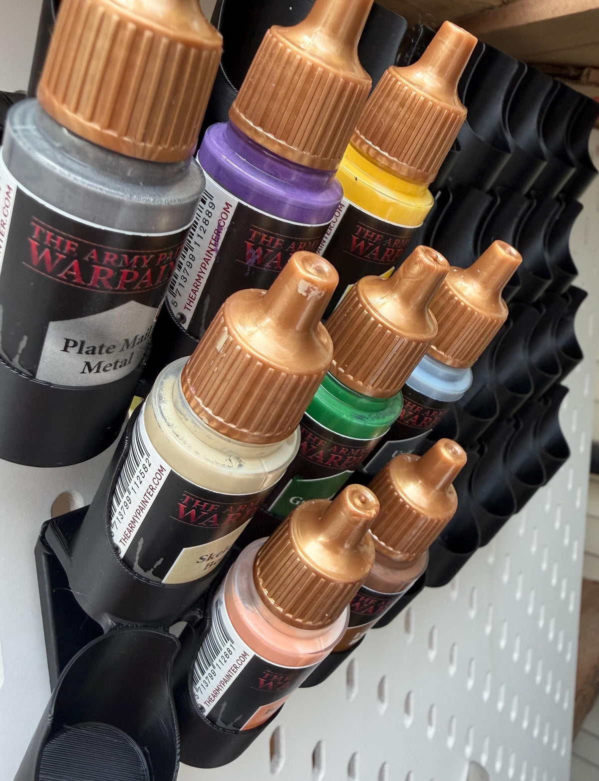 Black dropper bottle paint holders on IKEA SKÅDIS - side view with bottles