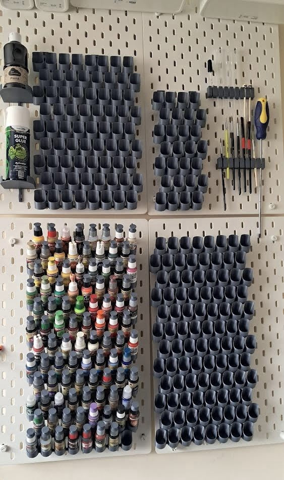 Grey dropper bottle paint holders for IKEA SKÅDIS - multi-board workshop view