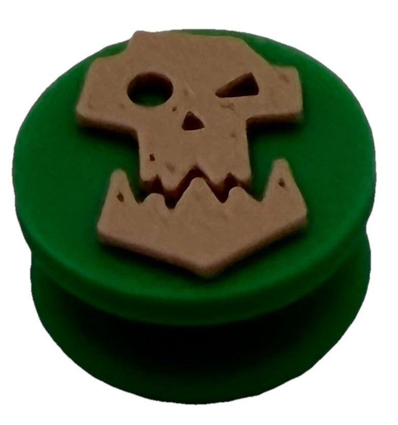 Green orc skull shoe charm with cream skull design, front view