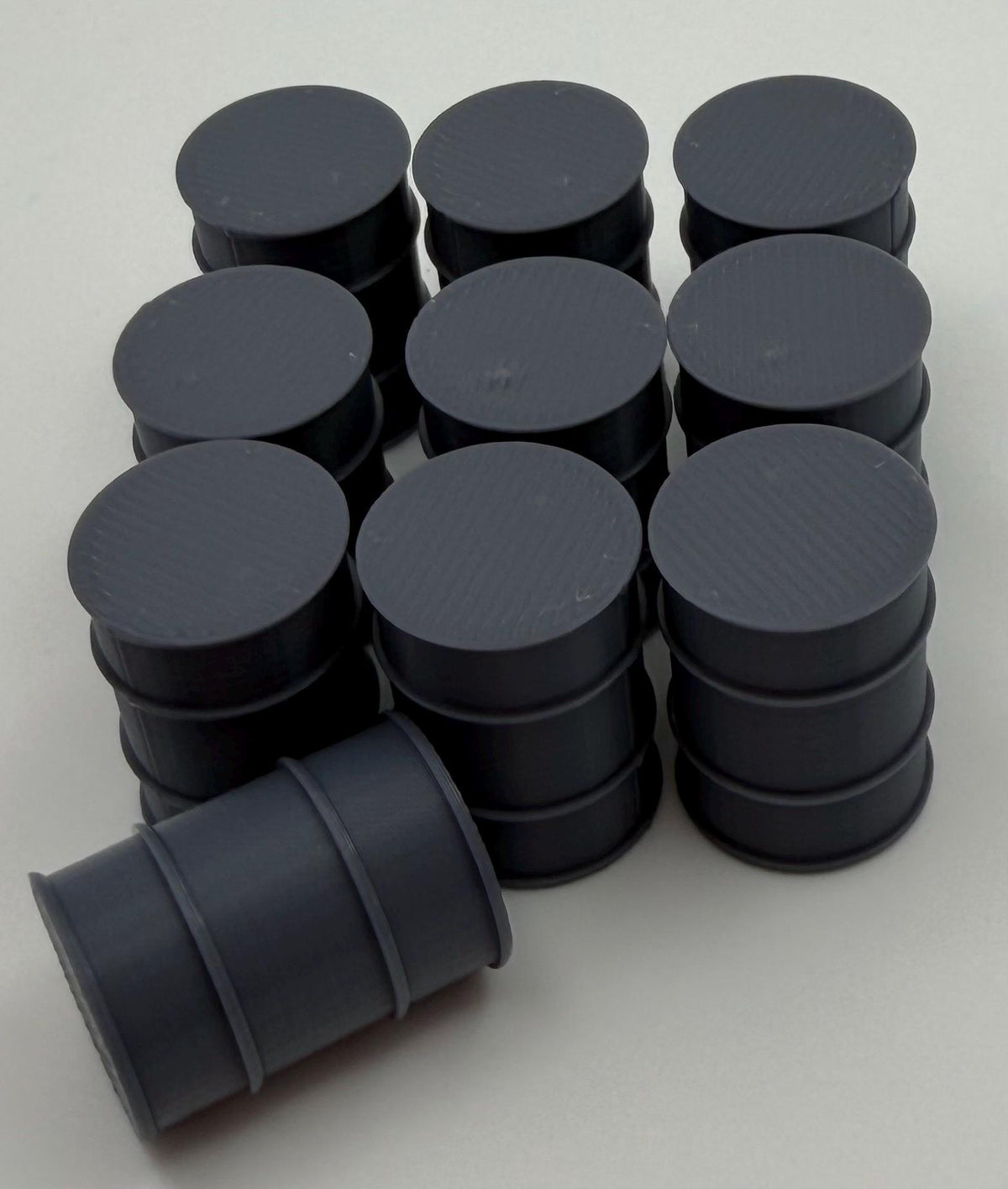 Industrial fuel drums arranged in rows as a storage yard