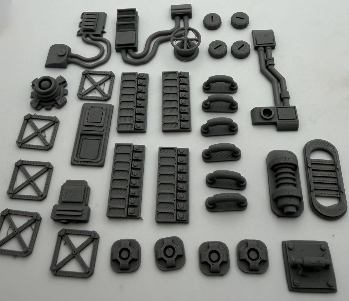 33 piece industrial greebles set 3 laid out: panels, pipes, vents and hatches