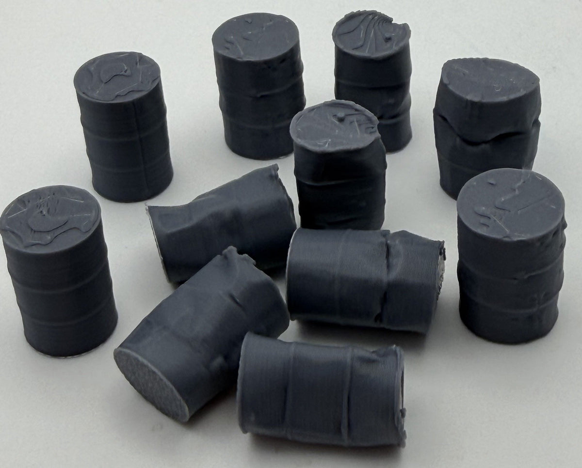 Group of mixed condition oil drums including fallen drums