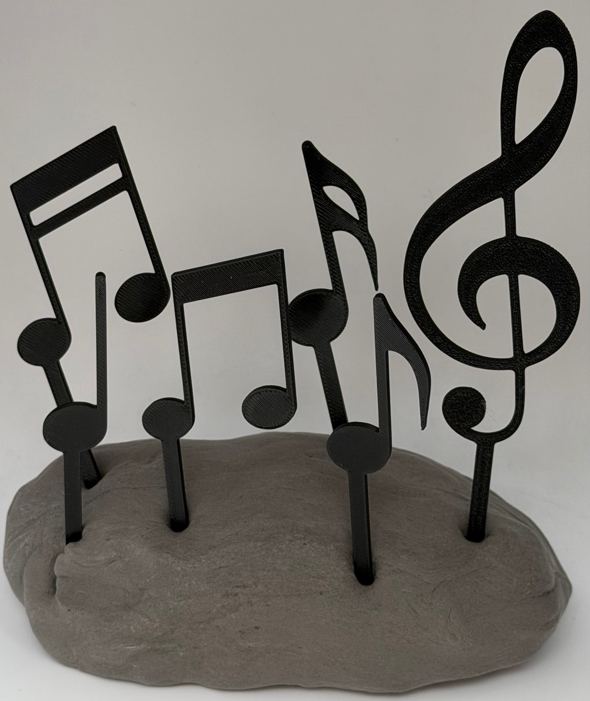 Music notes cake topper set arranged as on a cake