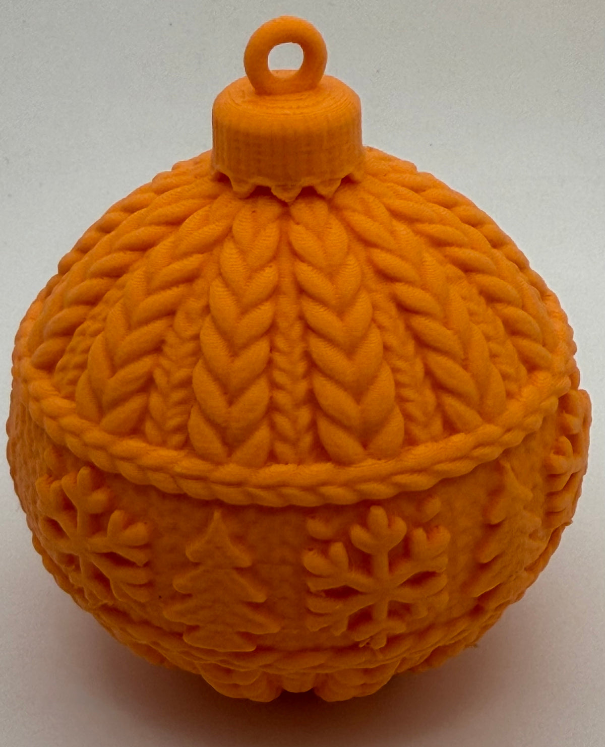 Orange knitted-effect 3D printed Christmas bauble, matte finish