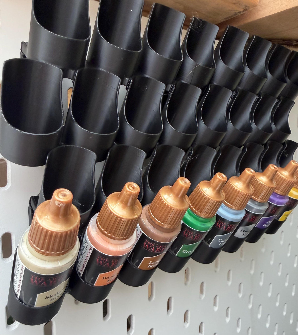 Black dropper bottle holders for SKÅDIS holding dropper bottles