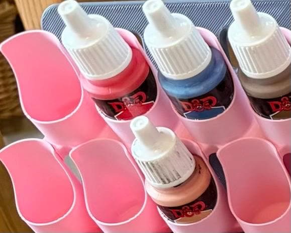 Pink dropper bottle holders for SKÅDIS close-up