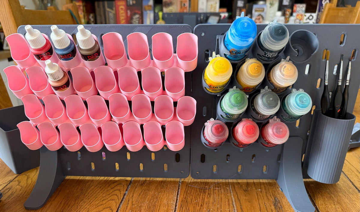 Pink dropper bottle holders and grey staggered pot holders side by side - stand, boards and brush pot not included