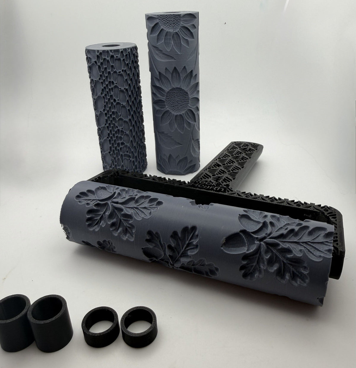 All black texture roller handle with two rollers and the adaptor rings