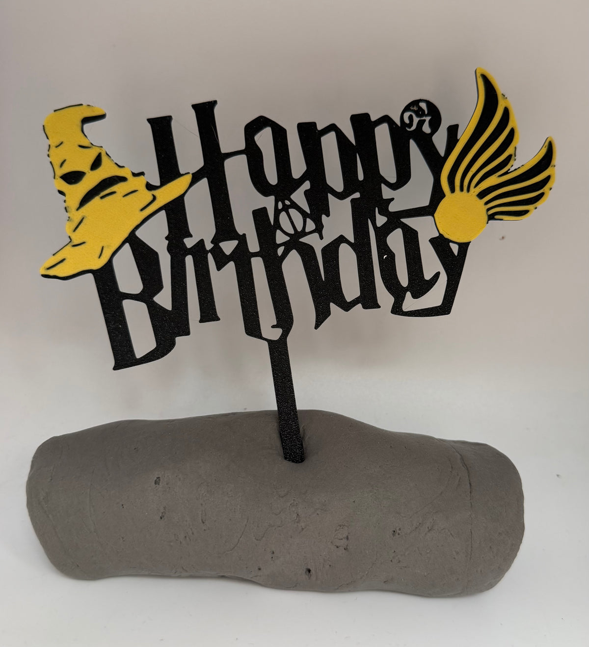 Black and gold magical Happy Birthday cake topper detail